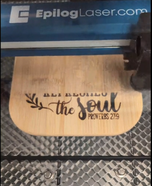 A wooden plaque with the words " let people the soul proverbs 2 1 9."