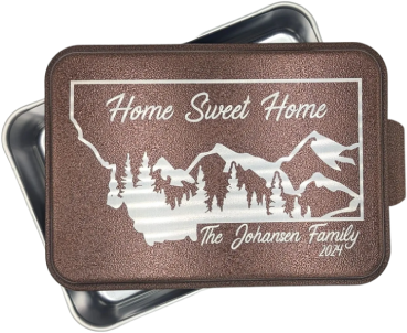 A metal box with the words home sweet home engraved on it.