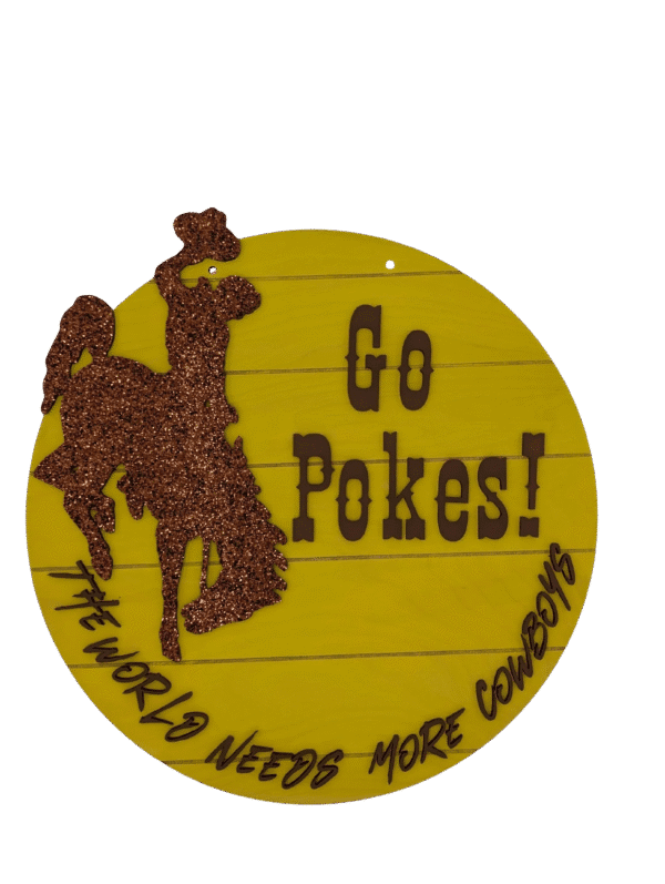 Red Rooster Laser Arts Show your University of Wyoming pride with this DIY Door Hanger Kit featuring a yellow oval sign, glittery brown cowboy silhouette, bold Go Pokes! text, and THE WORLD NEEDS MORE COWBOYS script—perfect for your door!.