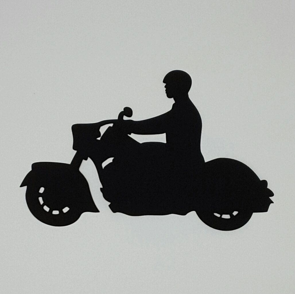 A man riding on the back of a motorcycle.