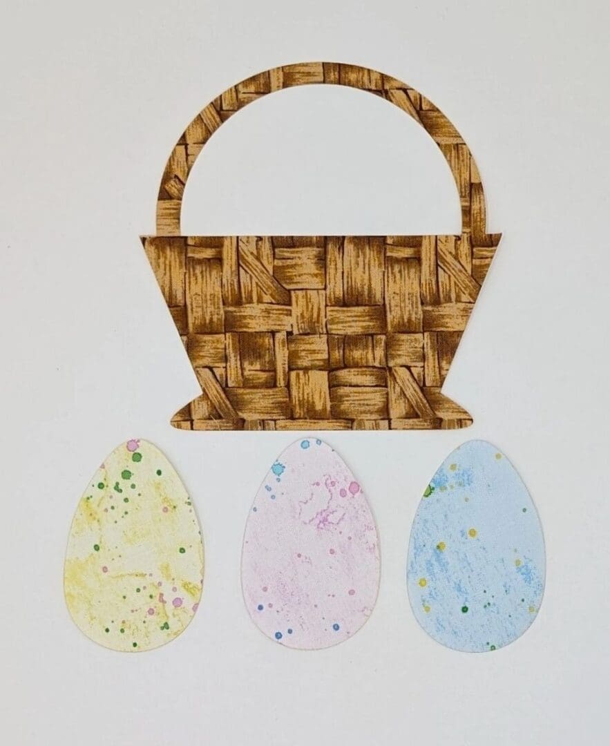 A basket with three different colored eggs on it.