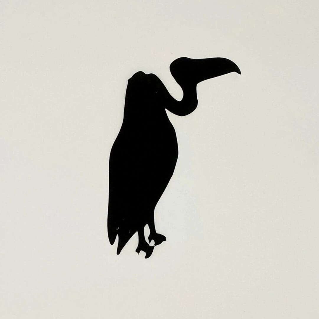 A silhouette of a bird with long legs and beak.