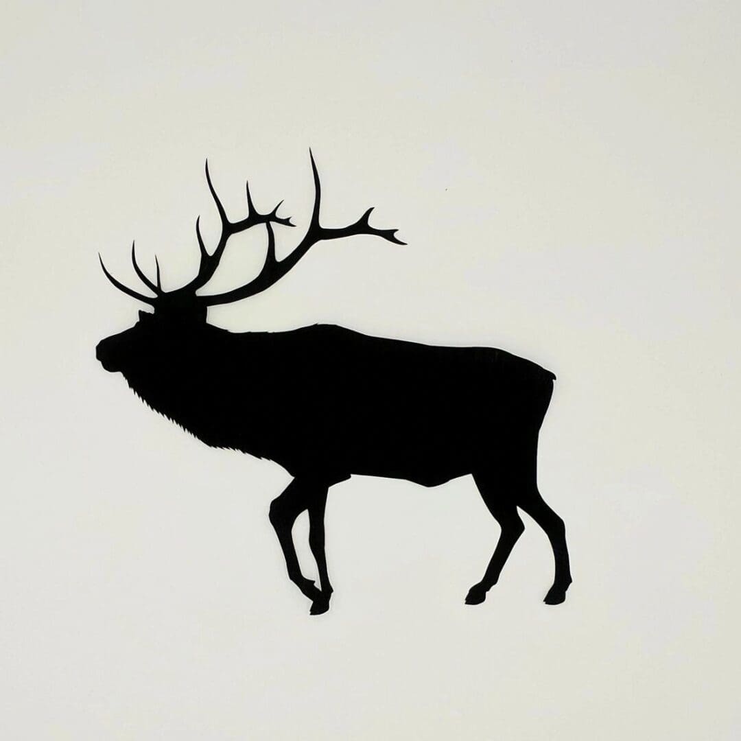 A silhouette of an elk with antlers on the side.