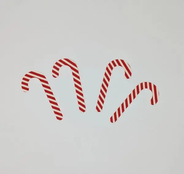 A group of candy canes are arranged in the shape of an x.