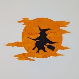 A witch flying on her broom in front of the moon.