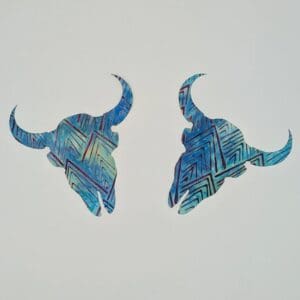 A pair of blue animal horns with a white background