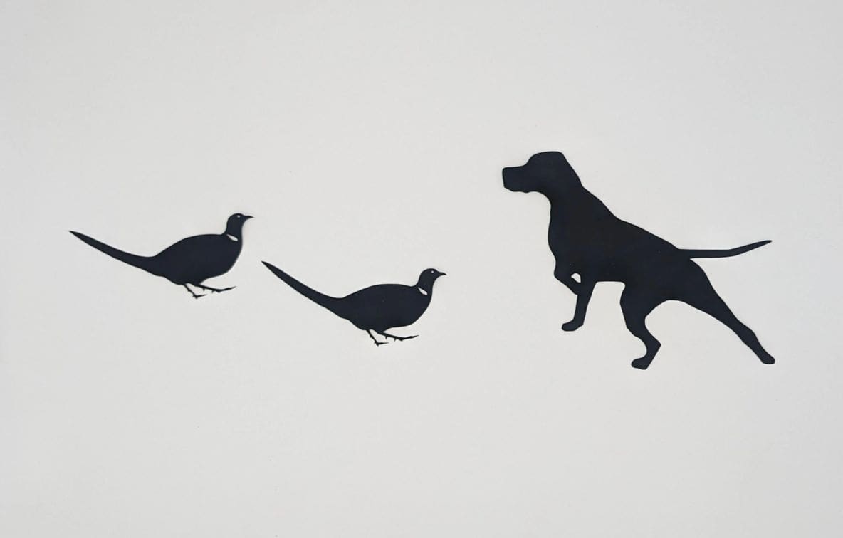 A dog and two birds flying in the sky.