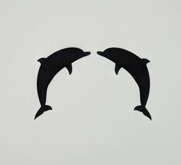 Two dolphins are shown in silhouette against a white background.