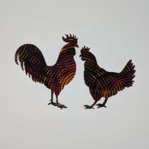 Two roosters are standing next to each other.