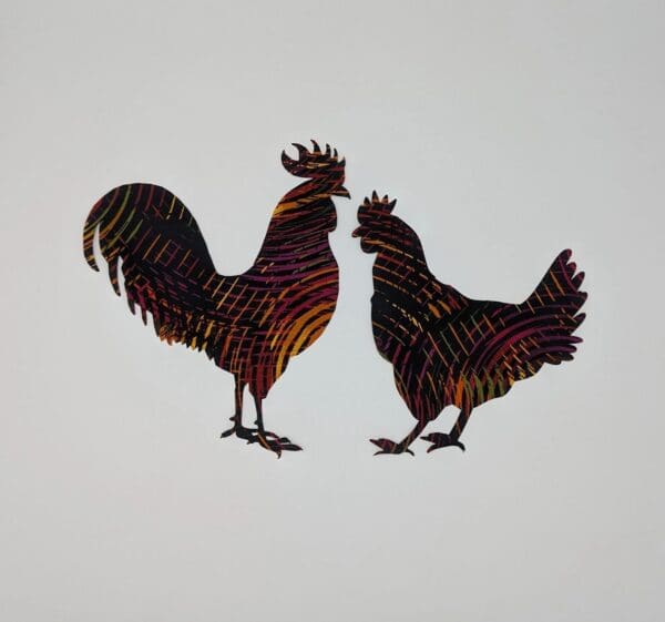 Two roosters are standing next to each other.