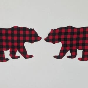 Two bears are facing opposite directions in a plaid pattern.