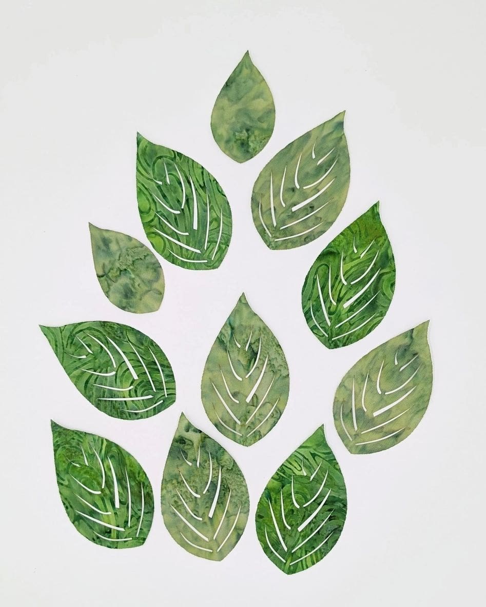 A group of green leaves that are arranged in the shape of a leaf.