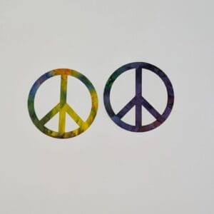 Two peace signs are shown in a rainbow color.