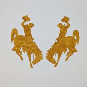 A pair of gold bucking horse magnets.