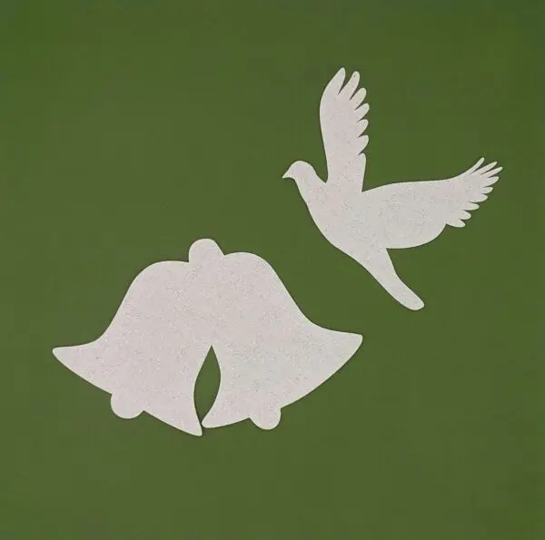 A white bird and two bells on a green background