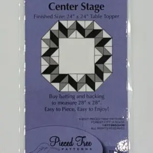 A black and white picture of a center stage quilt pattern.