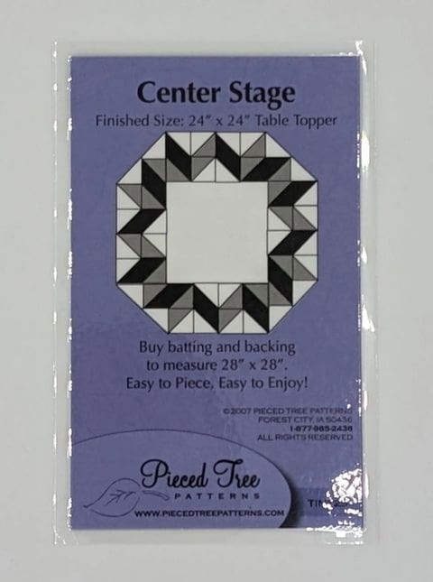 A black and white picture of a center stage quilt pattern.