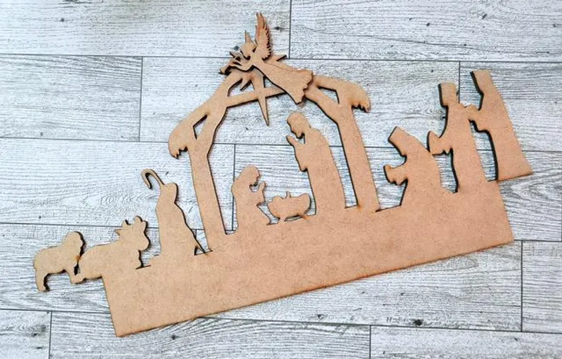 Red Rooster Laser Arts The Interchangeable Door Hanger Insert - Nativity Scene features a wood silhouette of Mary, Joseph, and baby Jesus under a stable roof—perfect as a DIY Christmas decor accent for your home or door.