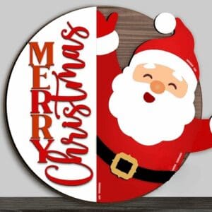 Red Rooster Laser Arts The DIY Door Hanger Kit - Merry Christmas Santa features a round sign with "Merry Christmas" in red and a waving cartoon Santa Claus on a white and wood background.