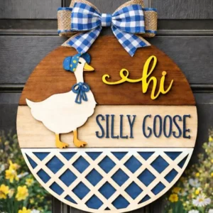 Red Rooster Laser Arts The DIY Door Hanger Kit - "Hey There Goose" features a round wooden hanger with a painted goose in a blue bonnet, blue and white checkered bow, “hi SILLY GOOSE” text in yellow and blue, plus yellow flowers in the background.