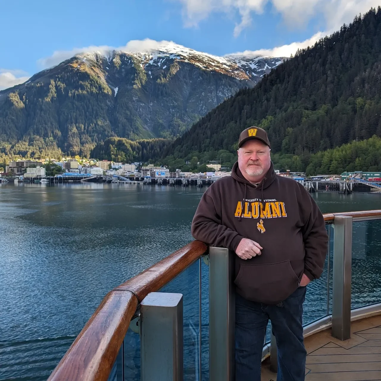 A man standing on the side of a river.